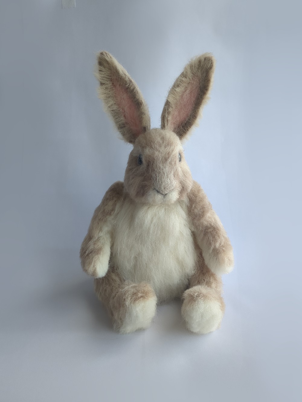 A handcrafted doll of Peetah the rabbit